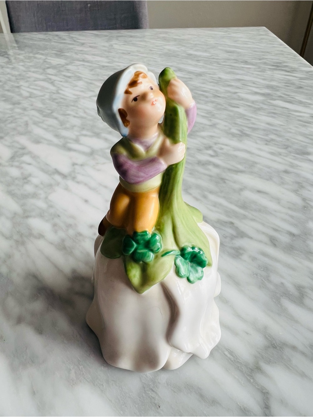 Vintage Avon Porcelain Figurine Boy on Leaf Bell